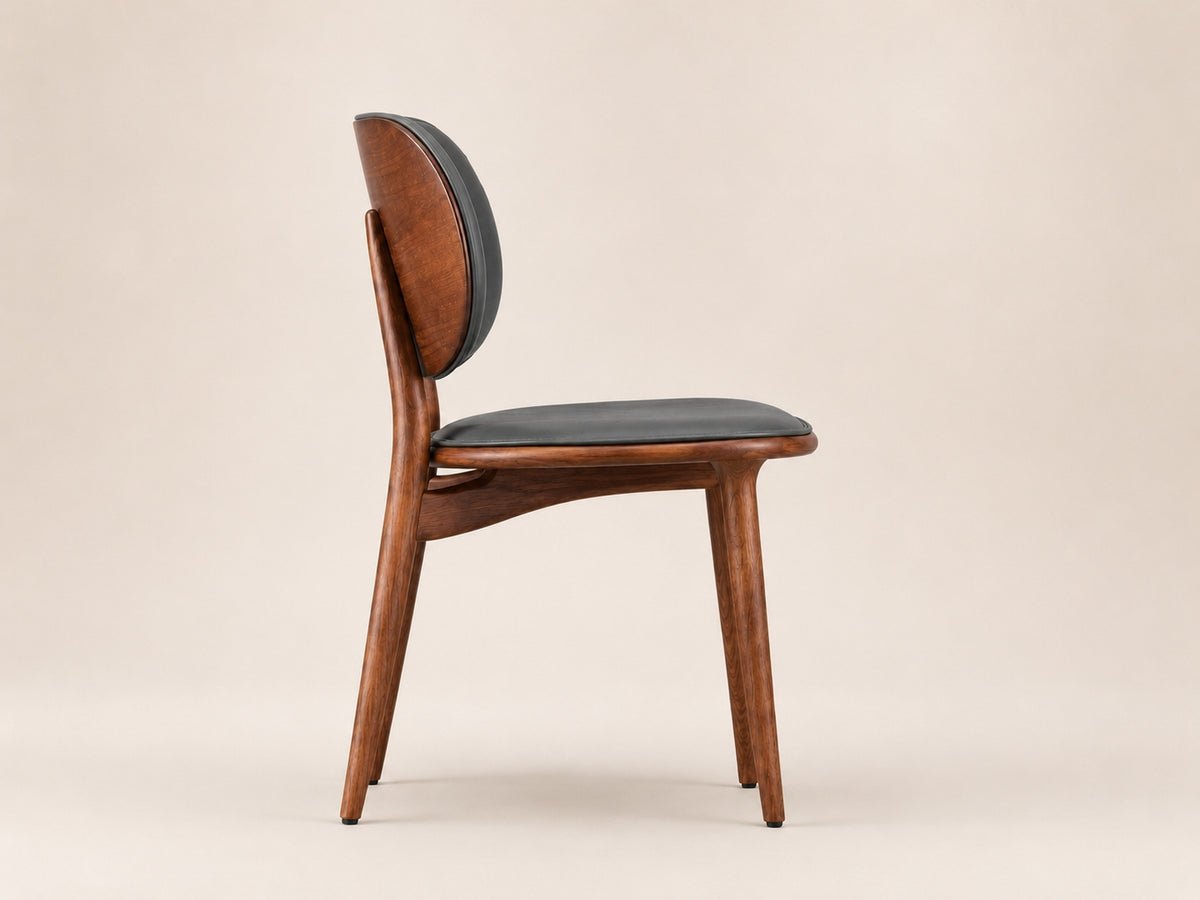 Aaron modern dining chair with solid ash wood finish, supportive comfort and refined contemporary proportions
