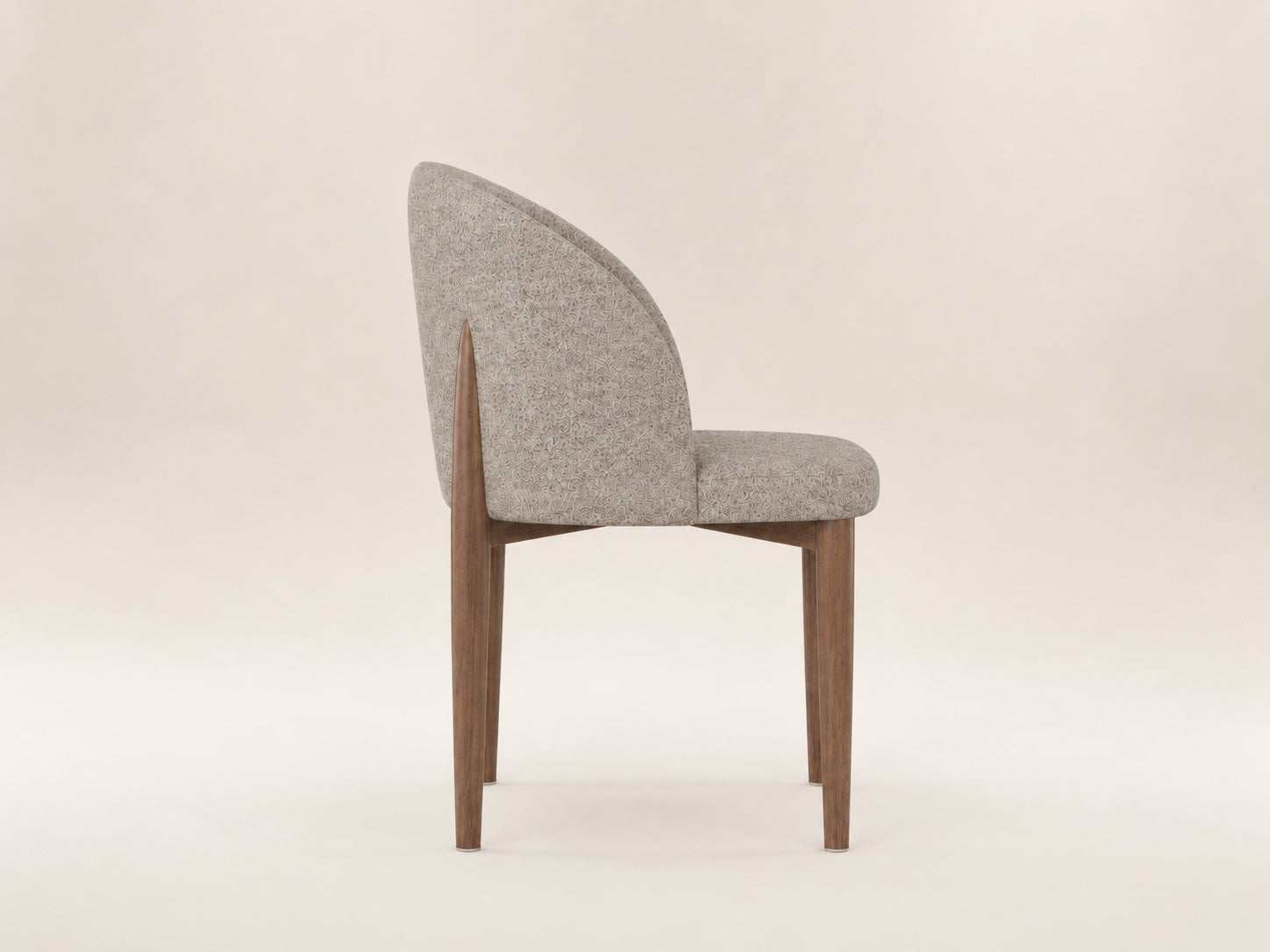 Andrea upholstered dining chair with gently flared legs, supportive comfort and a timeless modern silhouette