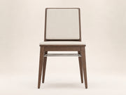 Arc Dining Chair by Canapy Furniture featuring an American walnut finish, upholstered seat and sculptural modern design