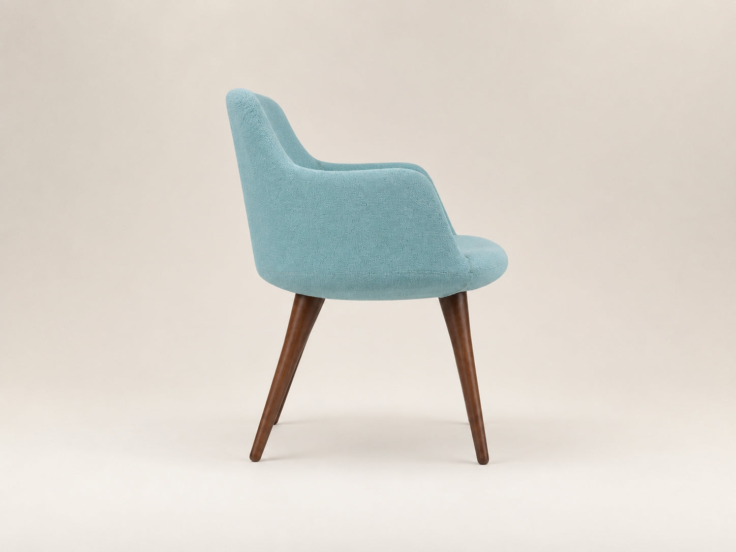 Dervish modern wood chair with a clean silhouette and elegant craftsmanship for contemporary interiors