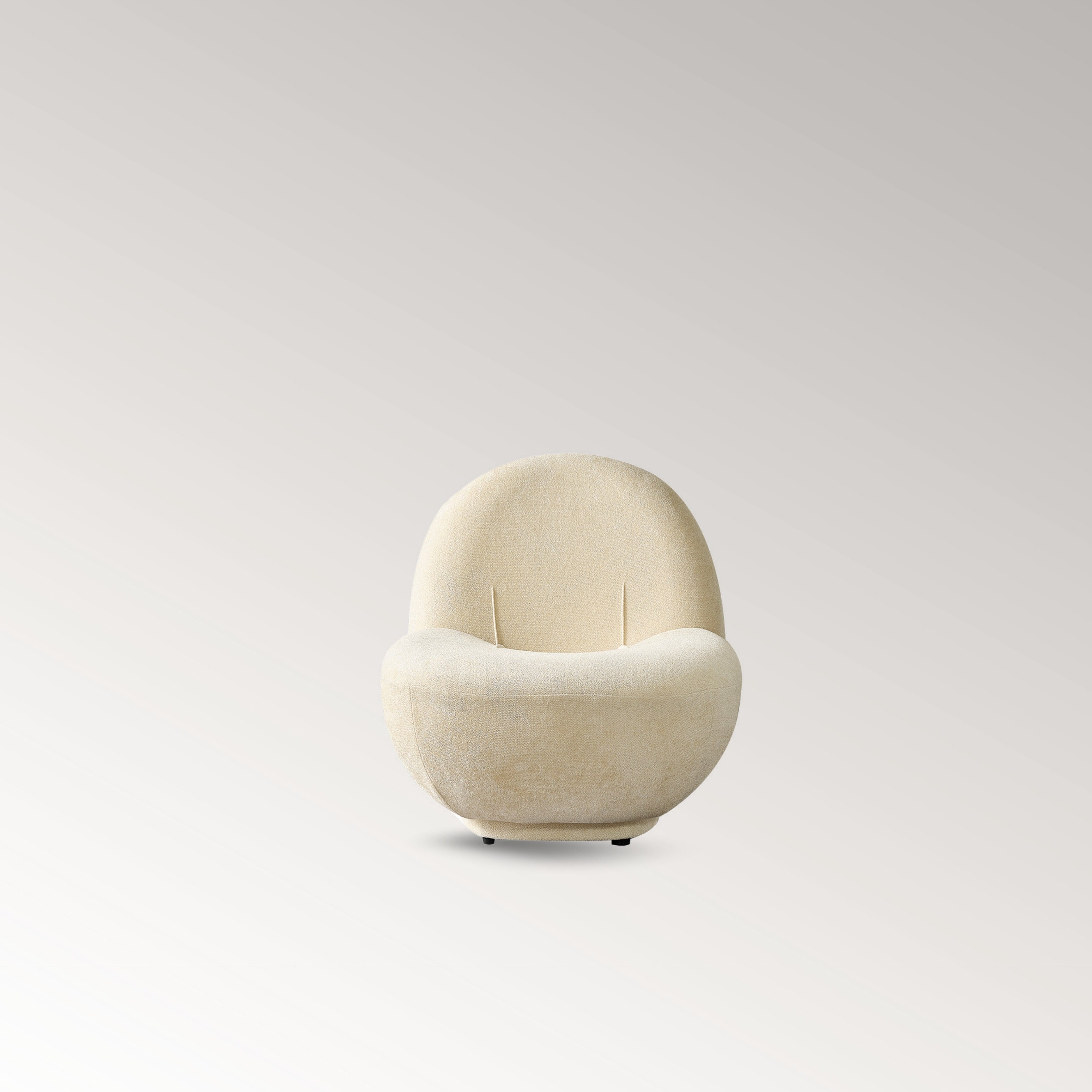 Elite Armchair Front view in cream textured fabric with sculptural curved design