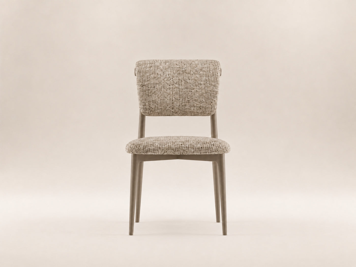 Enya Dining Chair by Canapy Furniture featuring a streamlined silhouette, angled backrest and cushioned modern comfort