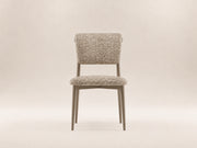 Enya Dining Chair by Canapy Furniture featuring a streamlined silhouette, angled backrest and cushioned modern comfort