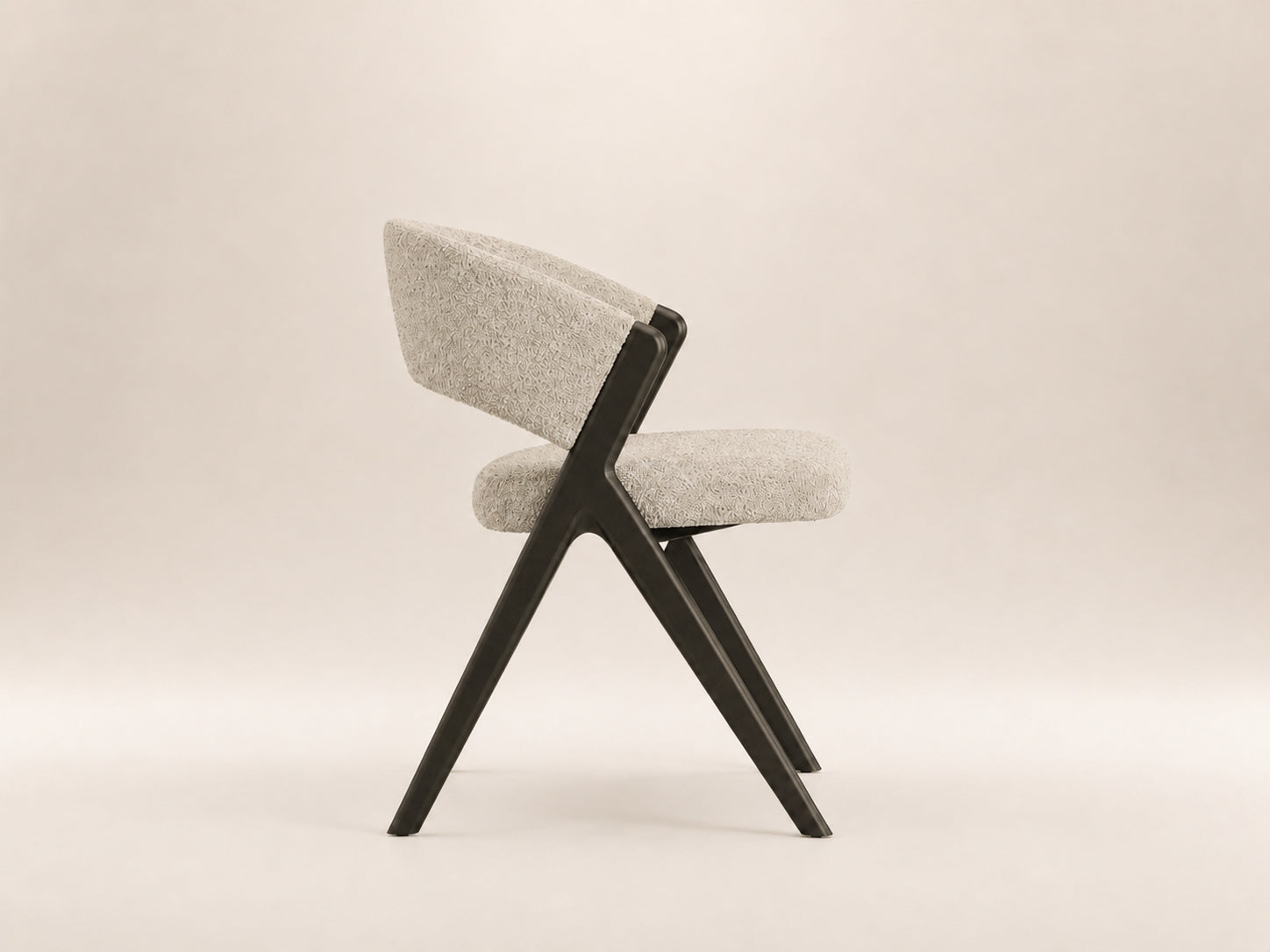 Koza modern dining chair with a sculptural profile and sophisticated design for contemporary dining spaces