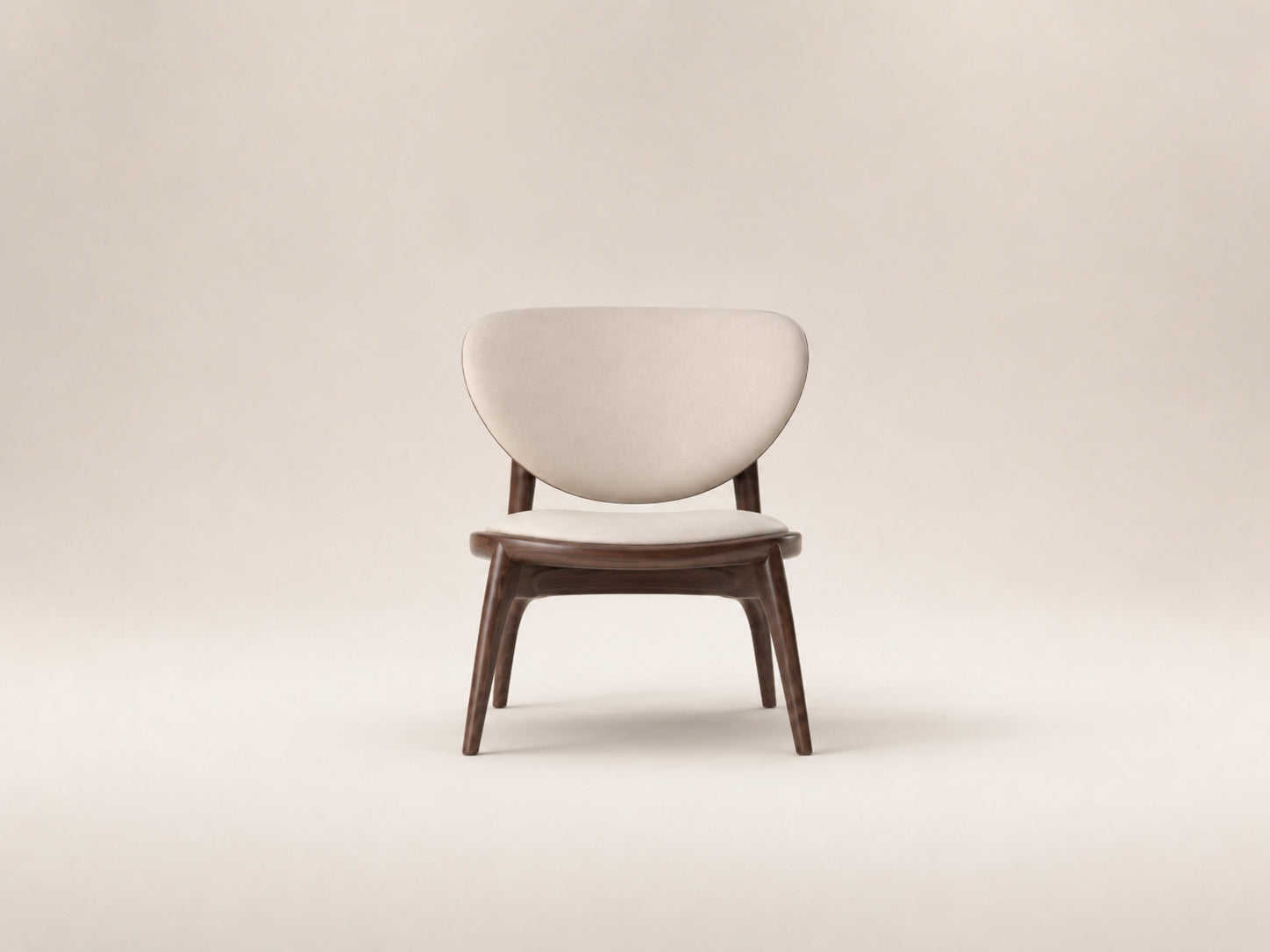 Lumora Chair by Canapy Furniture shown in a modern lounge setting with wood frame, upholstered seat and sculptural backrest