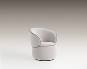 Moss Swivel Armchair in cream upholstery with black piping and rounded base on neutral background