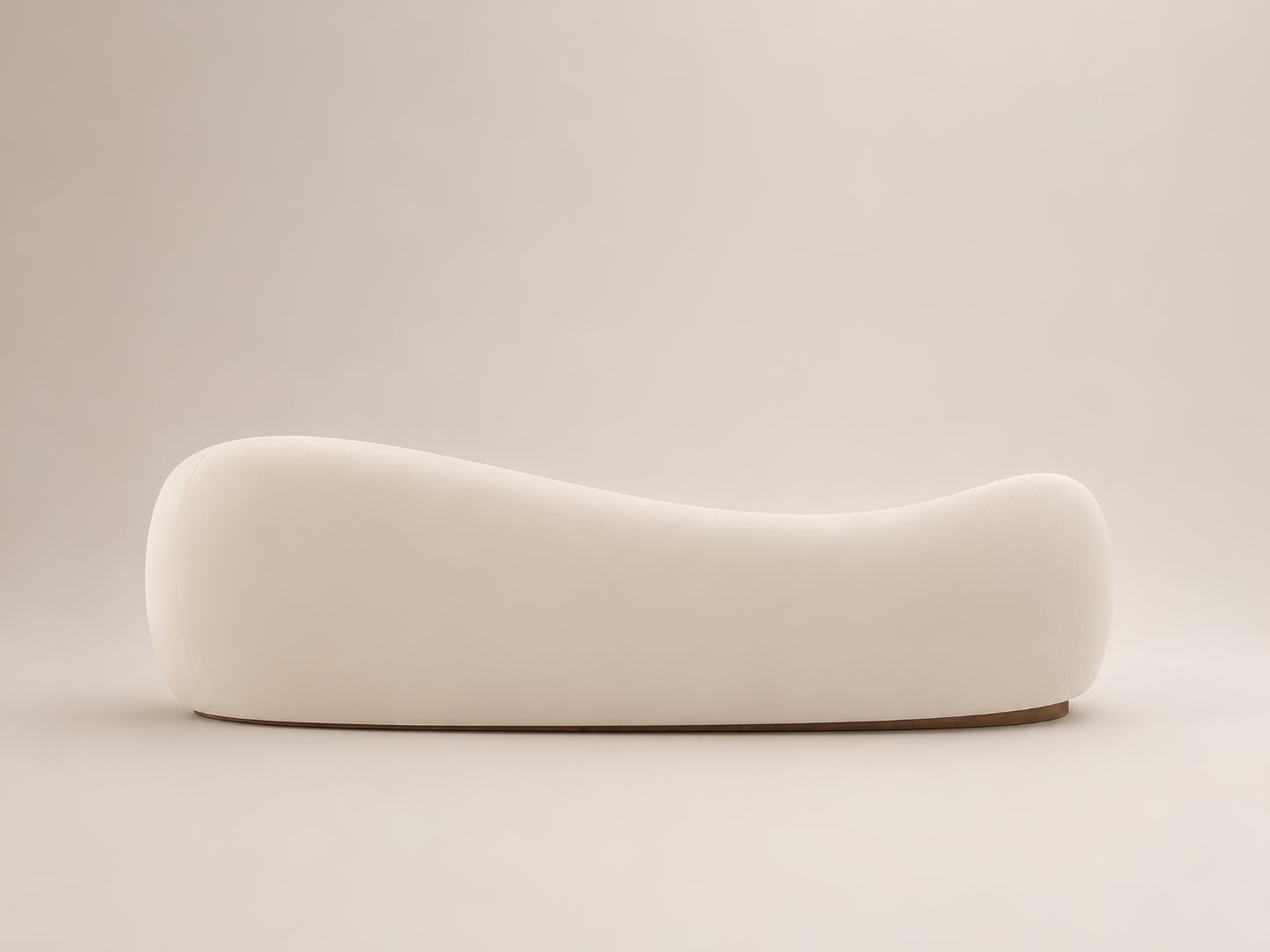 Orelle curved sofa by Canapy Furniture with deep cushioned comfort, soft modern lines and an elegant wooden base
