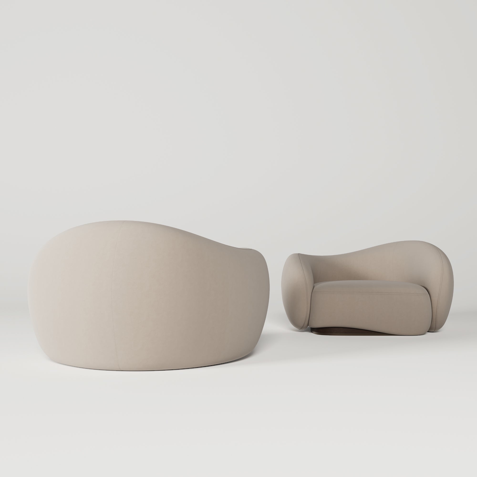 Two beige, organic-shaped chairs on a white background