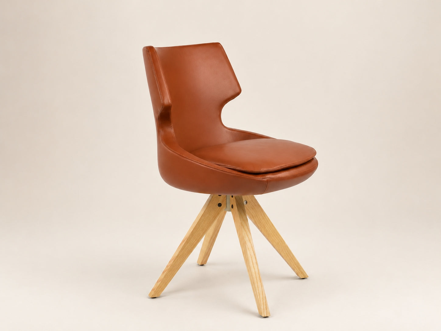 Patara Pyramid Swivel Chair by Canapy Furniture featuring an upholstered seat, backrest and swivel wood legs