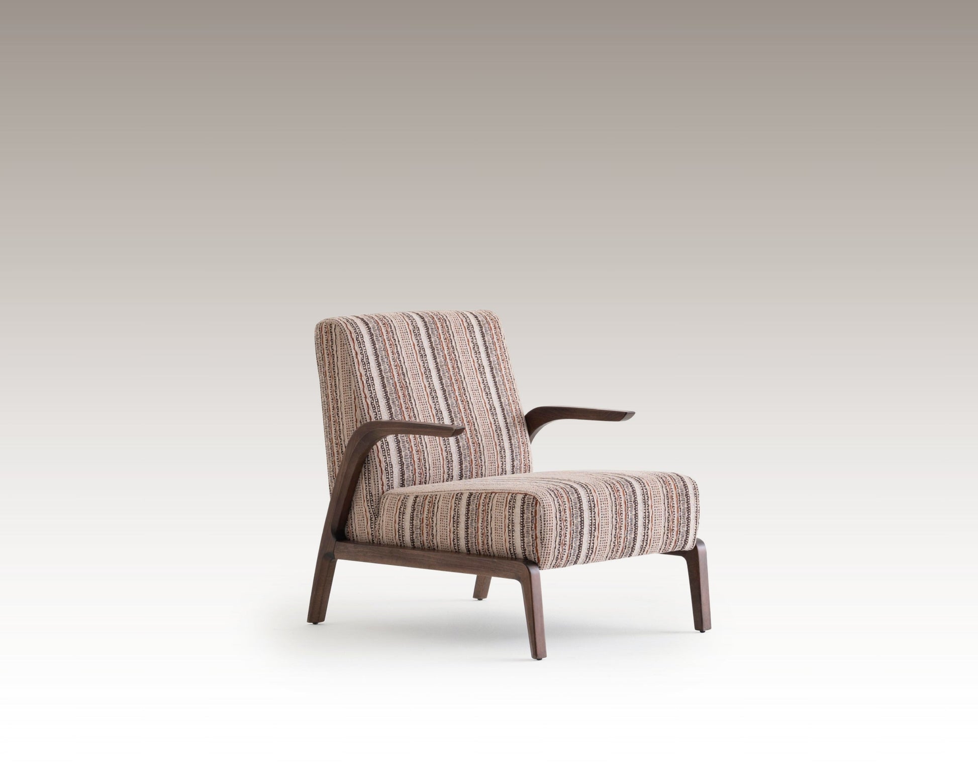 Side angle of Savanna Armchair showing curved wooden arms and vintage textile design