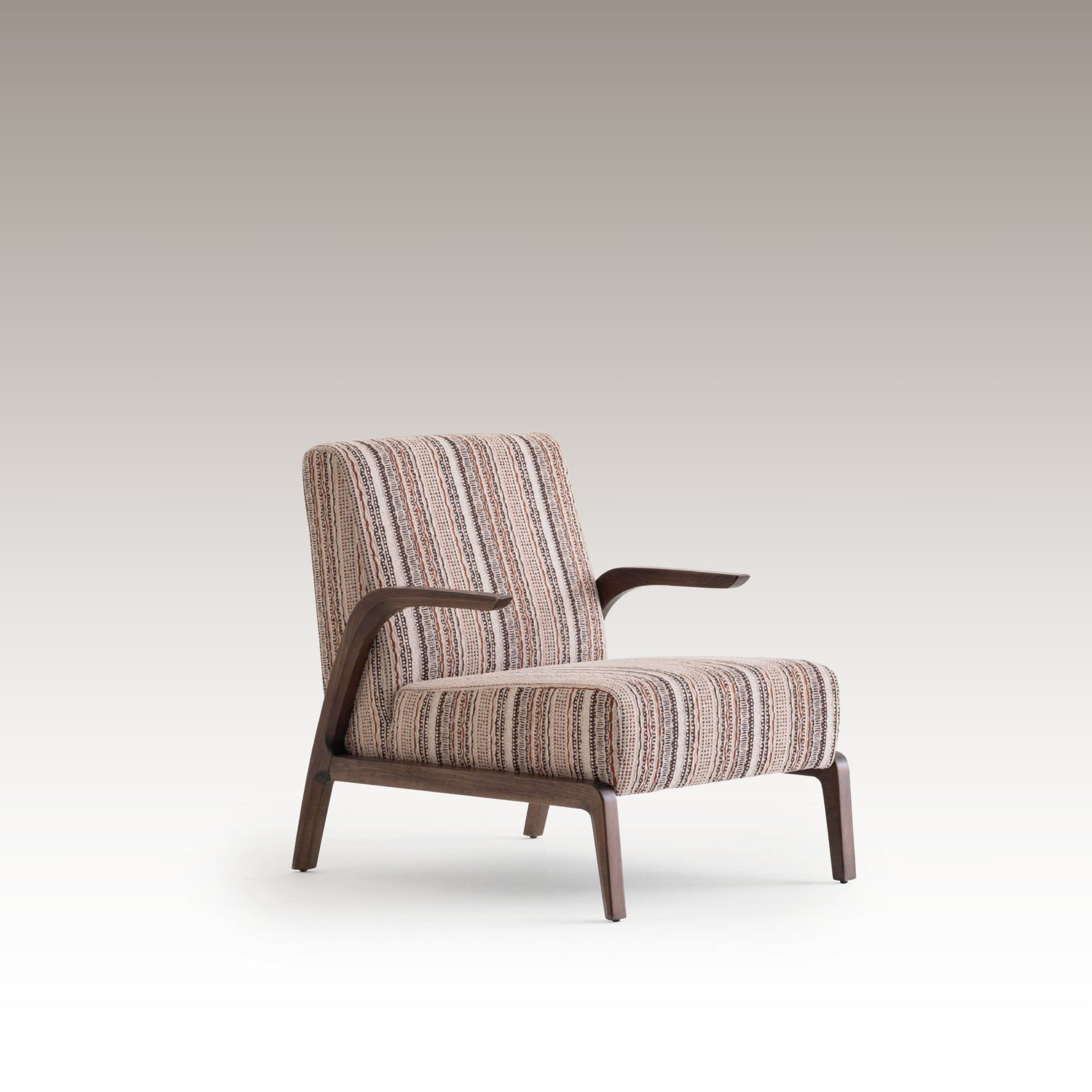 Side angle of Savanna Armchair showing curved wooden arms and vintage textile design