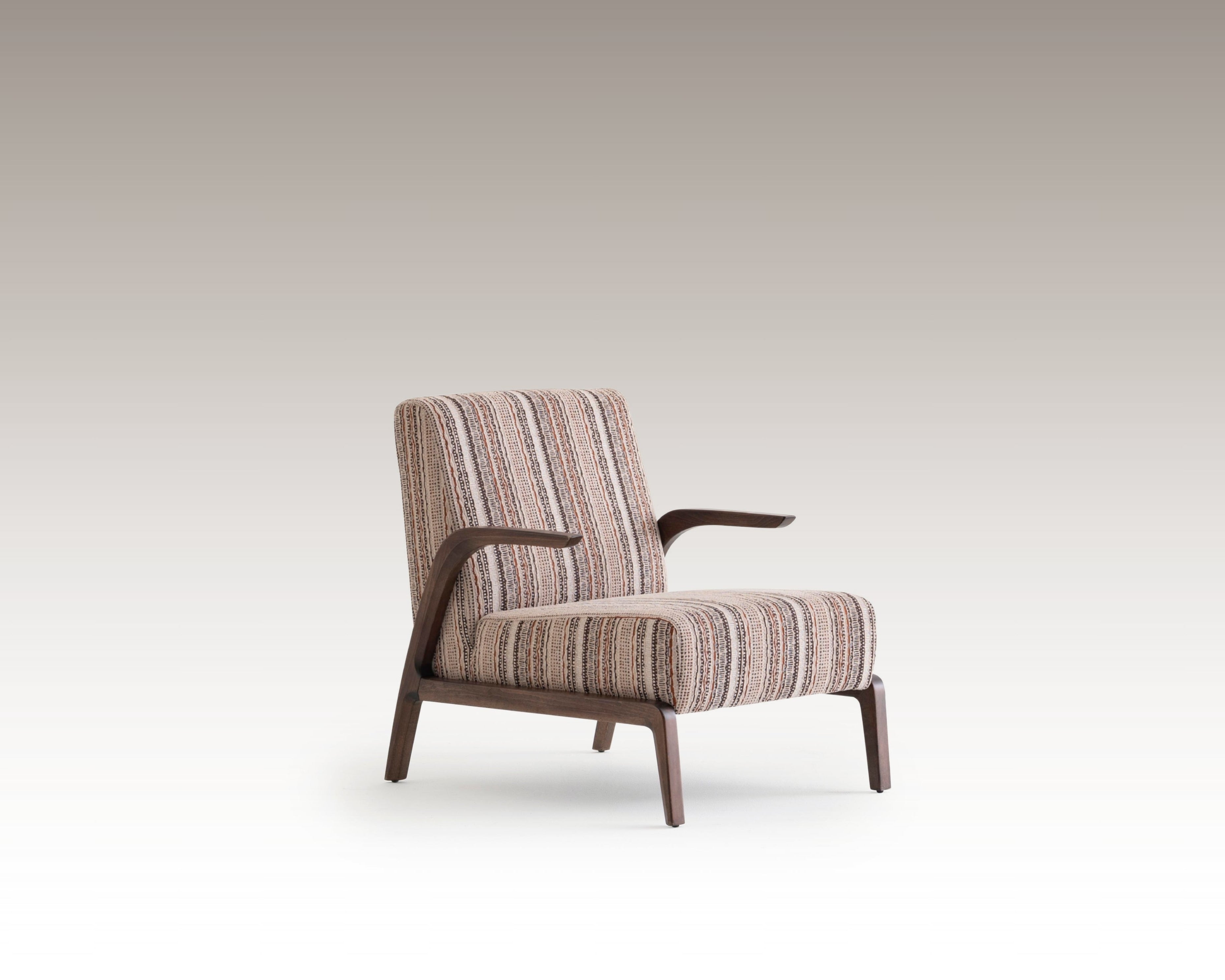 Side angle of Savanna Armchair showing curved wooden arms and vintage textile design