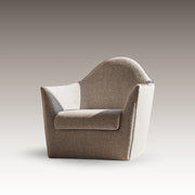 Serene Armchair in neutral woven fabric with sculptural arms and a high, arched back