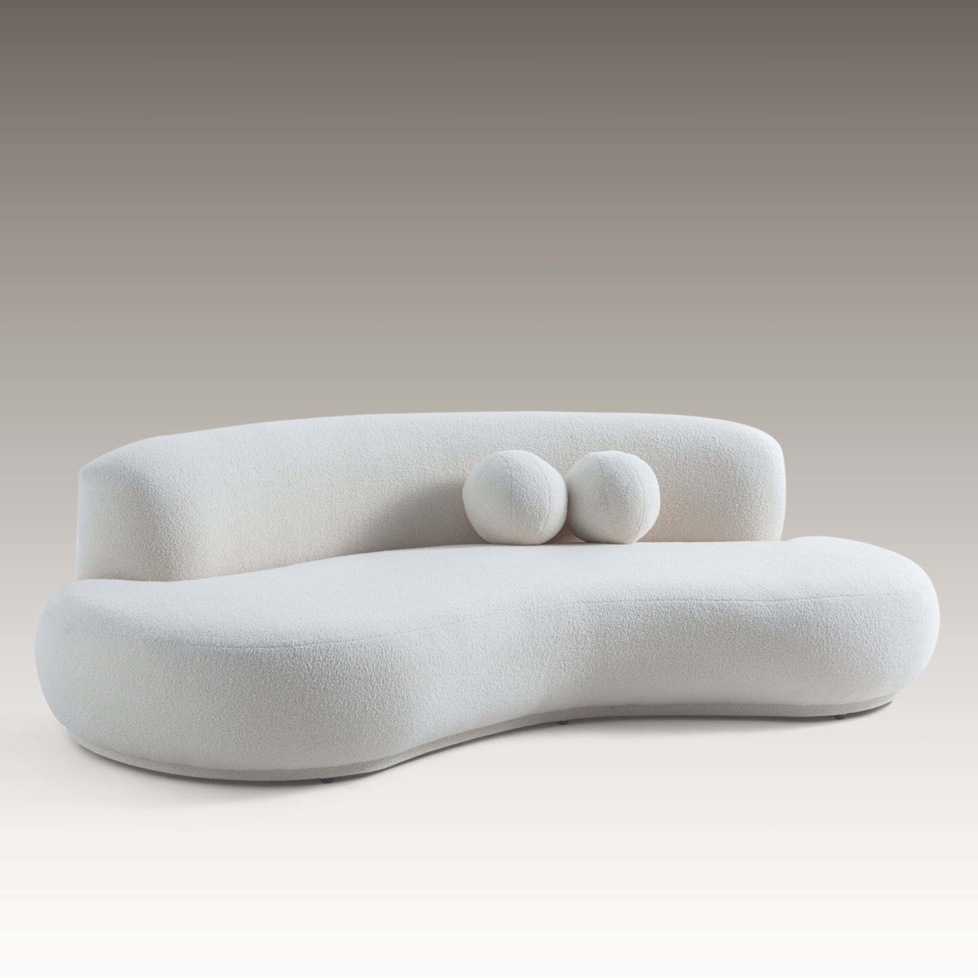 Teddy Sofa three-quarter view featuring soft curves and round cushions