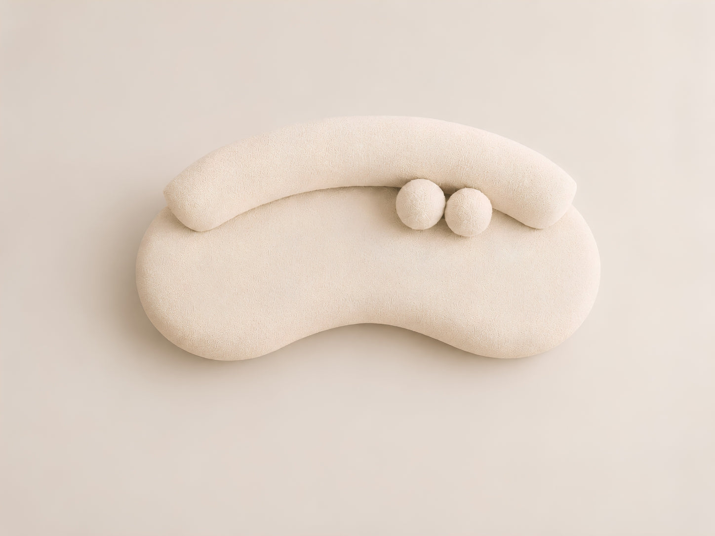 Top view of Teddy Sofa with curved silhouette and sphere cushions