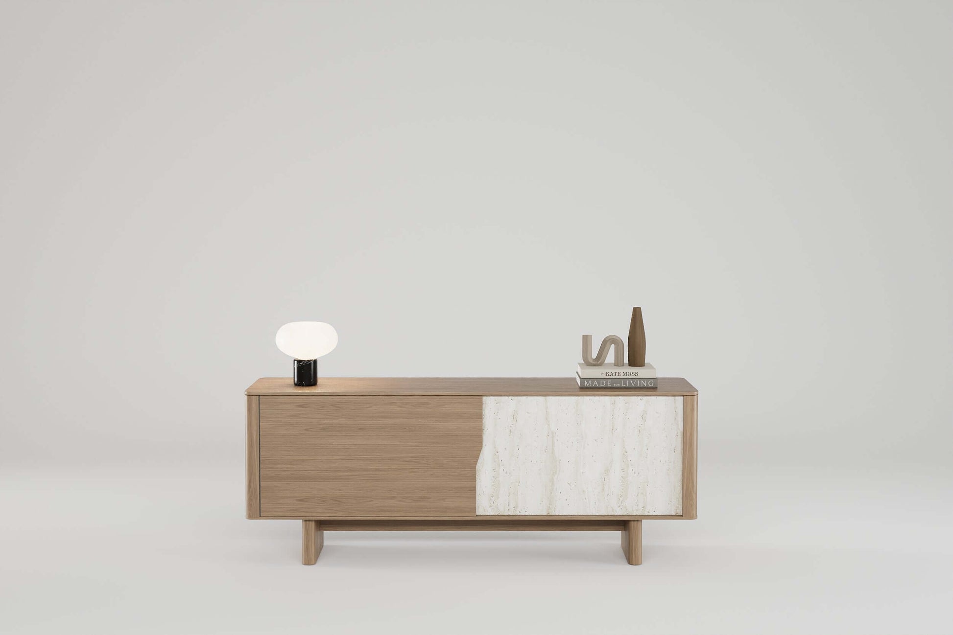 Tierra Oak Sideboard in warm oak with stone-textured panel and tapered legs.Minimalist design with natural materials and concealed storage.
