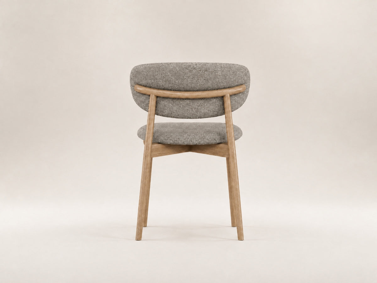 Tierre Oak Chair with premium fabric upholstery, rounded silhouette and timeless contemporary comfort