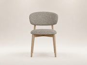 Tierre Oak Dining Chair by Canapy Furniture featuring a curved upholstered backrest and solid oak frame