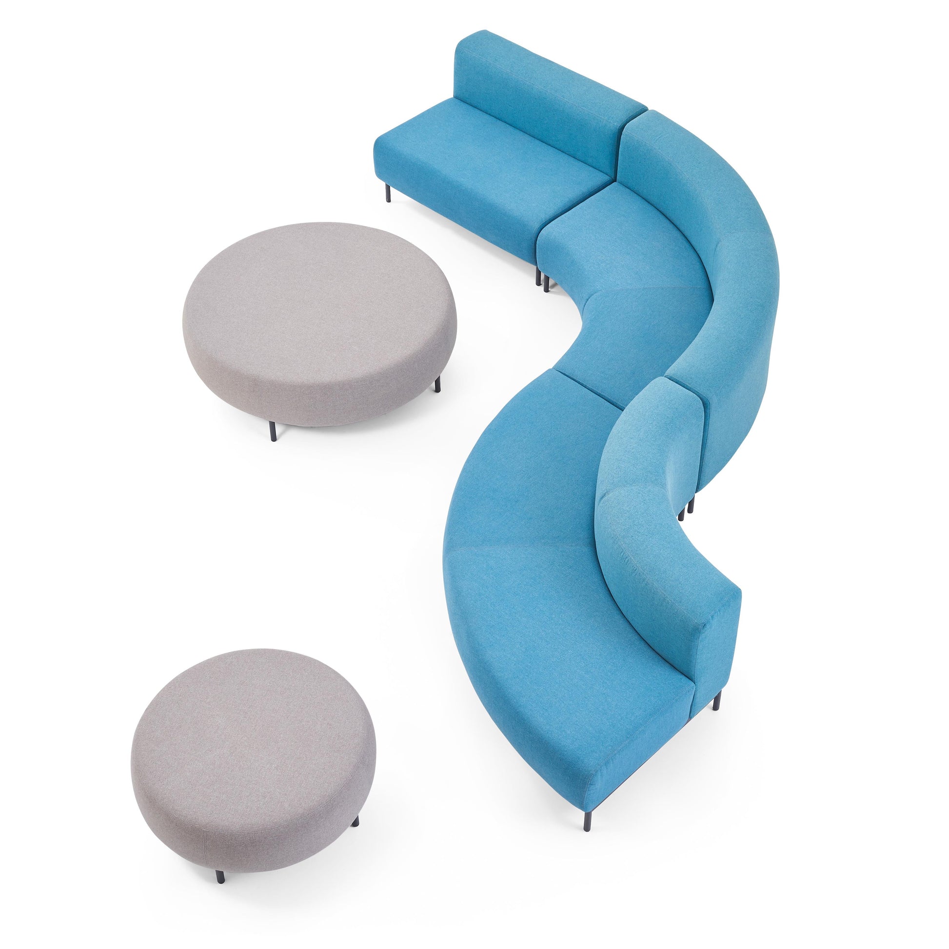 Blue curved sofa with two gray ottomans on a white background
