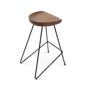 Wooden stool with black metal legs on a white background
