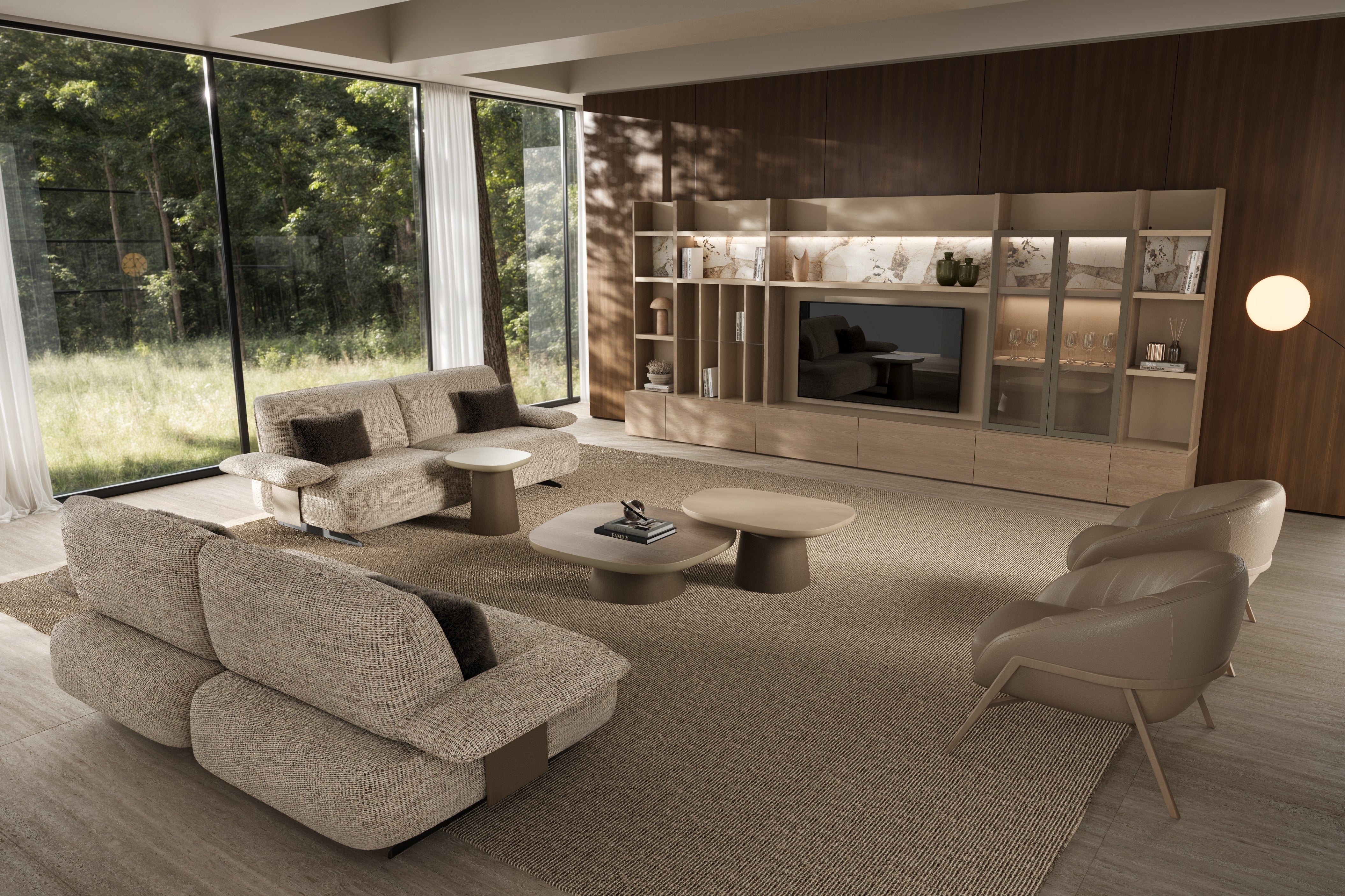 Modern living room with beige sofa, chairs, and a television set.
