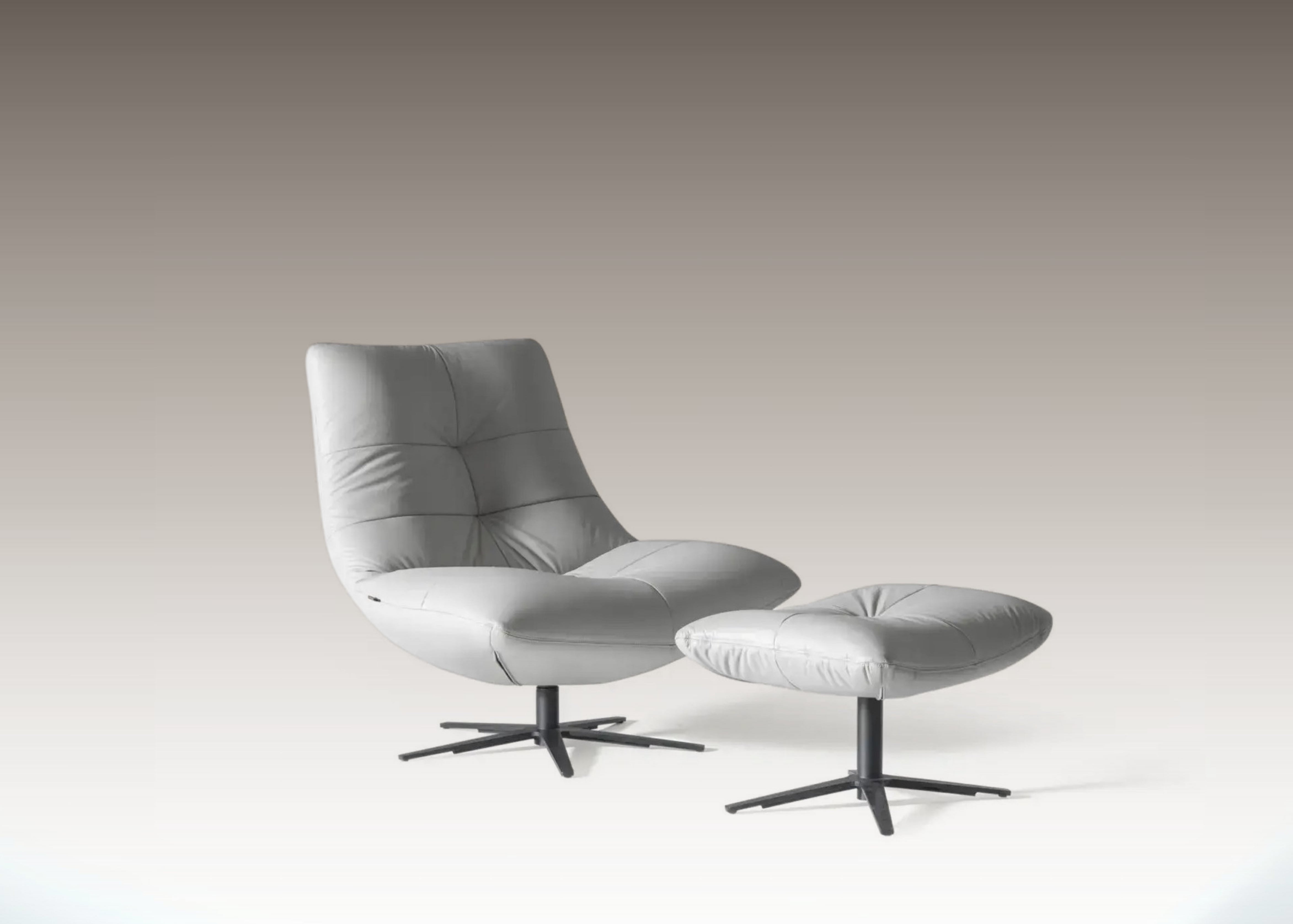 Zen Resting Chair shown at an angle with matching pouf on light background