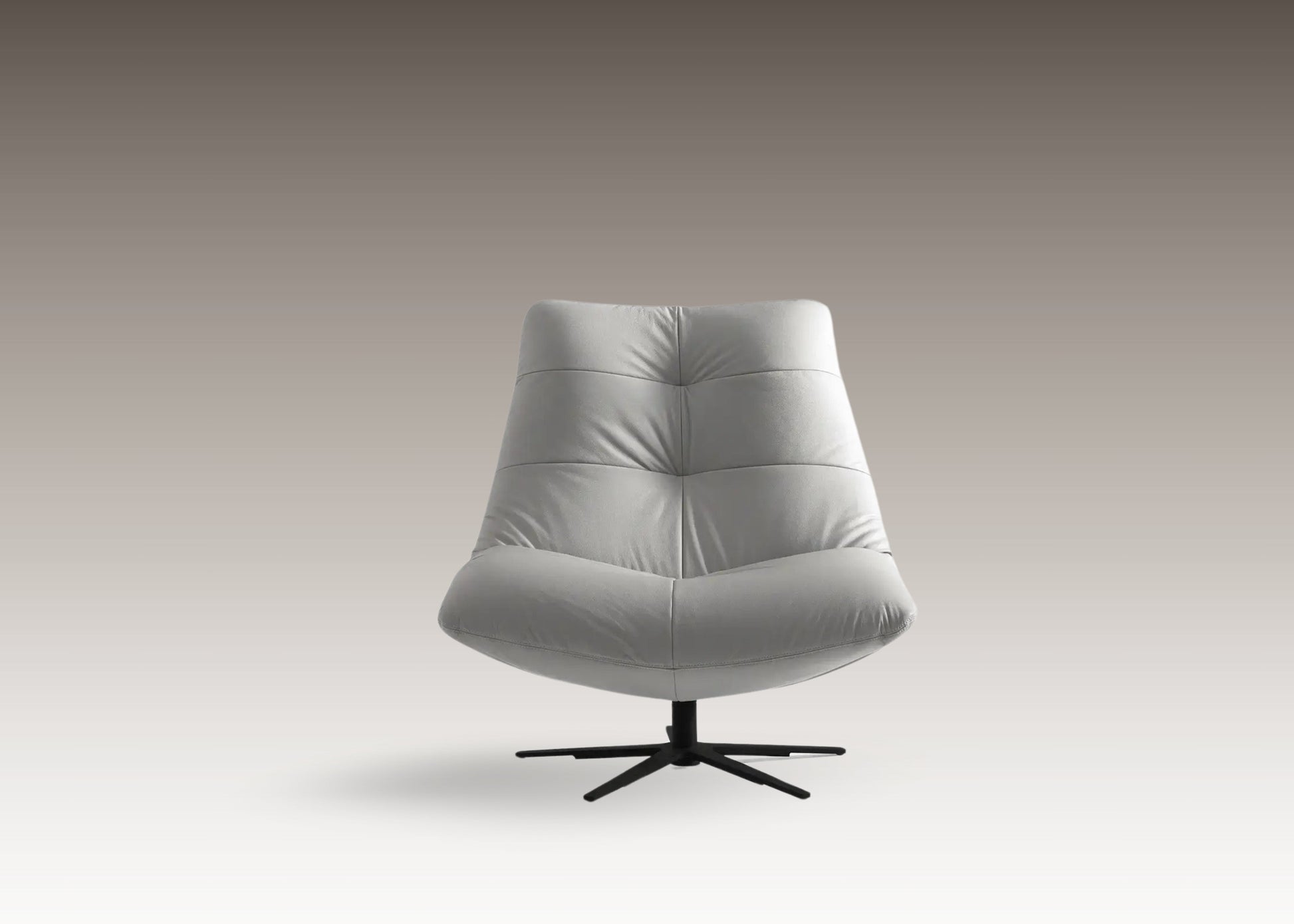 Front view of the Zen Resting Chair in light grey leather-nubuck fabric with pouf